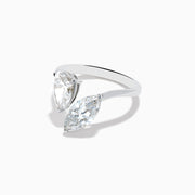 The Lab Grown Diamond Toi Et Moi Ring in 14K White Gold features two striking clear diamonds—a pear-shaped and a marquise-cut—set on open ends of the band, shown against a plain white background.