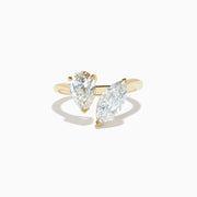 The Lab Grown Diamond Toi Et Moi Ring in 14K Yellow Gold features pear-shaped and marquise-cut lab diamonds set side by side, shown against a white background.