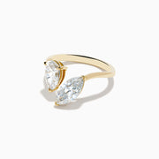 The Lab Grown Diamond Toi Et Moi Ring in 14K Yellow Gold features pear-shaped and marquise-cut lab diamonds set side by side, shown against a white background.