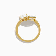The Lab Grown Diamond Toi Et Moi Ring in 14K Yellow Gold features pear-shaped and marquise-cut lab diamonds set side by side, shown against a white background.