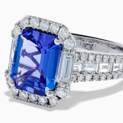 The Effy Hematian 18K White Gold Tanzanite and Diamond Halo Cocktail Ring is shown from the front, featuring an emerald-cut blue tanzanite with a diamond halo and diamond-accented band against a white background.
