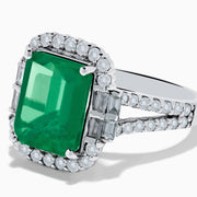 The Effy Hematian 14K White Gold Emerald and Diamond Cocktail Ring showcases a rectangular emerald surrounded by round and baguette diamonds on a sleek white gold band, displayed against a white background.