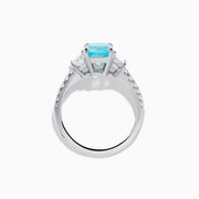 The Effy Hematian 18K White Gold Paraiba Tourmaline and Diamond Ring showcases a vibrant, large rectangular tourmaline center stone, flanked by two side diamonds and a band adorned with small round diamonds.