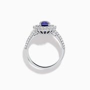 The 18K White Gold Purple Sapphire and Diamond Double Halo Ring features an oval purple sapphire center, two rows of white diamonds encircling it, and additional diamonds set along the band.