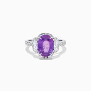 The Effy Hematian 18K White Gold Oval Purple Sapphire and Diamond Halo Ring features a central oval purple sapphire, two oval white diamonds, and smaller diamonds along the band, displayed on a white background.