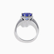 The Nahla Siri 14K Gold Octagon Cut Tanzanite and Diamond Ring showcases a large octagon-cut tanzanite at the center, bordered by sparkling diamonds, shown against a white background.