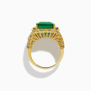 The 18K Yellow Gold Emerald and Diamond Ring features a large square green emerald center, encircled by round and baguette-cut white diamonds along the band and around the emerald, set against a white background.