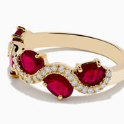 The 14K Yellow Gold Ruby and Diamond Ring showcases four oval rubies in a wavy design, accented with small white diamonds along the curves.