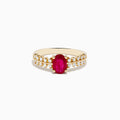 The 14K Yellow Gold Ruby and Diamond Ring features a central oval ruby accented by two rows of small round diamonds on each side, creating a sophisticated and elegant look.