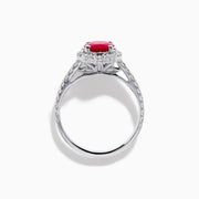 The Ruby Royale 14K White Gold Ruby and Diamond Ring showcases an oval red ruby center, a halo of round white diamonds, and additional diamonds along the band.