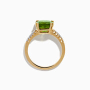 The 14K Yellow Gold Peridot and Diamond Ring features a large cushion-cut peridot at the center, accented by small diamonds set along the band on either side.