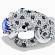 The Signature 14K White Gold Tanzanite and Diamond Panther Ring features diamond accents, green gemstone eyes, and a large oval tanzanite held in the panther's paws and mouth.