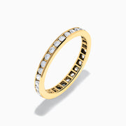The 14K Yellow Gold Channel Set Diamond Eternity Band, 0.50 TCW, features small round white diamonds encircling the band and is shown on a white background.