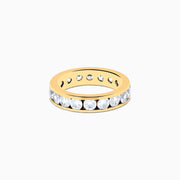 The 14K Yellow Gold Channel Set Diamond Eternity Band, 3.00 TCW, features round diamonds encircling the band and is displayed on a white background.