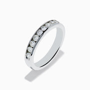 The 14K White Gold 10-Stone Channel Set Diamond Band, 0.50 TCW features a row of sparkling round diamonds set in white gold, shown against a plain white background.