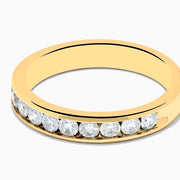The 14K Yellow Gold 10-Stone Channel Set Diamond Band, 0.50 TCW, features a row of round white diamonds set along the band and is displayed on a plain white background.