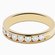 The 14K Yellow Gold 10-Stone Channel Set Diamond Band (0.75 TCW) features a row of round white diamonds in a channel setting, showcased against a plain white background.