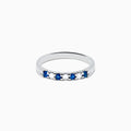 A 14K white gold band featuring alternating blue sapphires and diamonds (0.25 TCW), displayed against a white background.