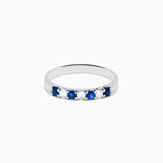 The 14K White Gold 7-Stone Blue Sapphire & Diamond Band (0.50 TCW) features alternating blue sapphires and diamonds set in a row, shown on a white background.