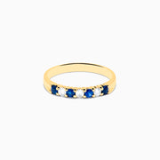 The 14K Yellow Gold 7-Stone Blue Sapphire & Diamond Band (0.50 TCW) features alternating sapphires and diamonds set in a row along the band, making it a striking accessory for any occasion. Displayed on a white background.