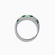 The 14K White Gold 7-Stone Emerald & Diamond Band (0.65 TCW) features alternating round emerald and diamond gemstones set in a row, displayed against a white background.