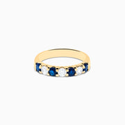The 14K Yellow Gold 7-Stone Blue Sapphire & Diamond Band (1.00 TCW) features alternating blue sapphires and clear diamonds in a row along the gold band, shown on a white background.