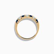 The 14K Yellow Gold 7-Stone Blue Sapphire & Diamond Band (1.00 TCW) features alternating blue sapphires and clear diamonds in a row along the gold band, shown on a white background.