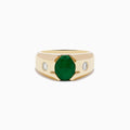 Mens 14K yellow gold emerald and diamond ring with a large oval emerald centerpiece and two small round diamonds set on each side, shown against a white background.