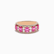 The 14K Rose Gold Pink Sapphire and Diamond Ring showcases a row of oval pink sapphires between two rows of small round white diamonds, set in rose gold and displayed against a white background.