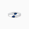 The Royal Bleu 14K White Gold Sapphire and Diamond Bypass Ring showcases two pear-shaped blue sapphires facing each other with a gap between them and a band accented by sparkling diamonds.