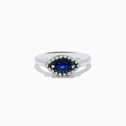 The Royal Bleu 14K White Gold Sapphire and Diamond Ring features a marquise-cut sapphire center, embraced by a halo of sparkling diamonds on a sleek white gold band.