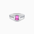 The 14K White Gold Pink Sapphire and Diamond Halo Ring showcases a vivid oval pink sapphire, encircled by a diamond halo with extra diamonds set along its elegant double band.