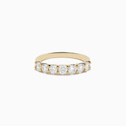 The DOro 14K Yellow Gold Round Brilliant Diamond Band 1.03 TCW showcases a row of sparkling round brilliant diamonds on a sleek yellow gold band, displayed against a plain white background.