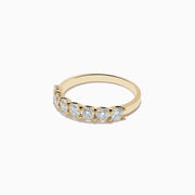 The DOro 14K Yellow Gold Round Brilliant Diamond Band 1.03 TCW showcases a row of sparkling round brilliant diamonds on a sleek yellow gold band, displayed against a plain white background.