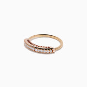 The 14K Rose Gold Flexible Size 7-10 Diamond Ring showcases a row of small, round white diamonds along the band and is shown on a plain white background. Adjustable fit ensures comfort for any occasion.