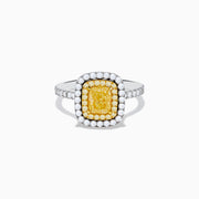 The 18K Two Toned Gold GIA certified Yellow and White Diamond Halo Ring features a rectangular yellow center stone, double halos of white diamonds, and extra diamonds along the band for exceptional brilliance.