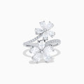 The Lab Grown Pear and Round Diamond 2.75ct Flower Bypass Ring in 14K White Gold features two flower designs with pear-shaped and round diamonds on a partially encrusted band, set against a white background for an elegant look.