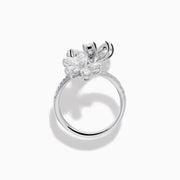 The Lab Grown Pear and Round Diamond 2.75ct Flower Bypass Ring in 14K White Gold features two flower designs with pear-shaped and round diamonds on a partially encrusted band, set against a white background for an elegant look.