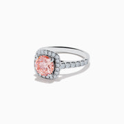 The 14K White Gold Lab Grown Pink and White Diamond Ring features a large oval pink center stone, a halo of lab grown diamonds, and additional diamonds on the band, displayed against a white background.