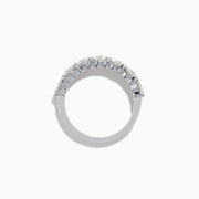 The Lab Grown Diamond Wedding Band in 14K White Gold showcases round, sparkling lab diamonds in a shared-prong setting on a sleek band, set against a white background.