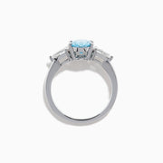 The Lab Grown Blue and White Diamond 3-Stone Ring in 14K White Gold showcases an oval blue centerpiece with two pear-shaped lab grown diamonds on each side, all set in elegant white gold.