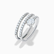 The Lab Grown Diamond Wrap Around Round Ring in 14K white gold showcases three curved, diamond-studded bands and a large round lab diamond at the center, set against a white background.