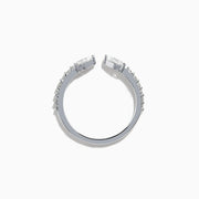 The Lab Grown Diamond Open Shank Pear Band in 14K white gold features two pear-shaped diamonds at each end and small round stones along the band.