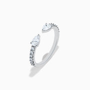 The Lab Grown Diamond Open Shank Pear Band in 14K white gold features two pear-shaped diamonds at each end and small round stones along the band.