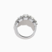 The Lab Grown Emerald Cut Diamond Halo Band in 14K White Gold showcases a luxurious row of large emerald-cut lab grown diamonds, accented by smaller round diamonds in an intricate halo design.