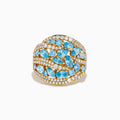Make a statement with our Lab Grown Blue and White Diamond Statement Ring in 14K Yellow Gold, featuring marquise-cut blue stones and rows of lab-grown diamonds in an elegant wavy design.