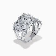 The Lab Grown Multi Shape Diamond Wide Ring in 14K White Gold displays marquise, baguette, and round-cut lab grown diamonds set in an elaborate, interwoven silver design for a sparkling, textured look.