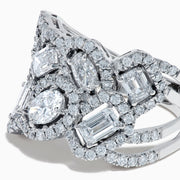 The Lab Grown Multi Shape Diamond Wide Ring in 14K White Gold displays marquise, baguette, and round-cut lab grown diamonds set in an elaborate, interwoven silver design for a sparkling, textured look.