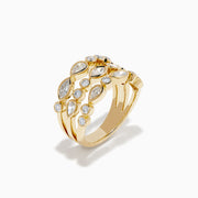 The Lab Grown Multi Shape Diamond Triple Row Bezel Ring in 14K Yellow Gold features three stacked bands with round and marquise lab grown diamonds set in bezel settings, creating a repeating diamond pattern around each row.