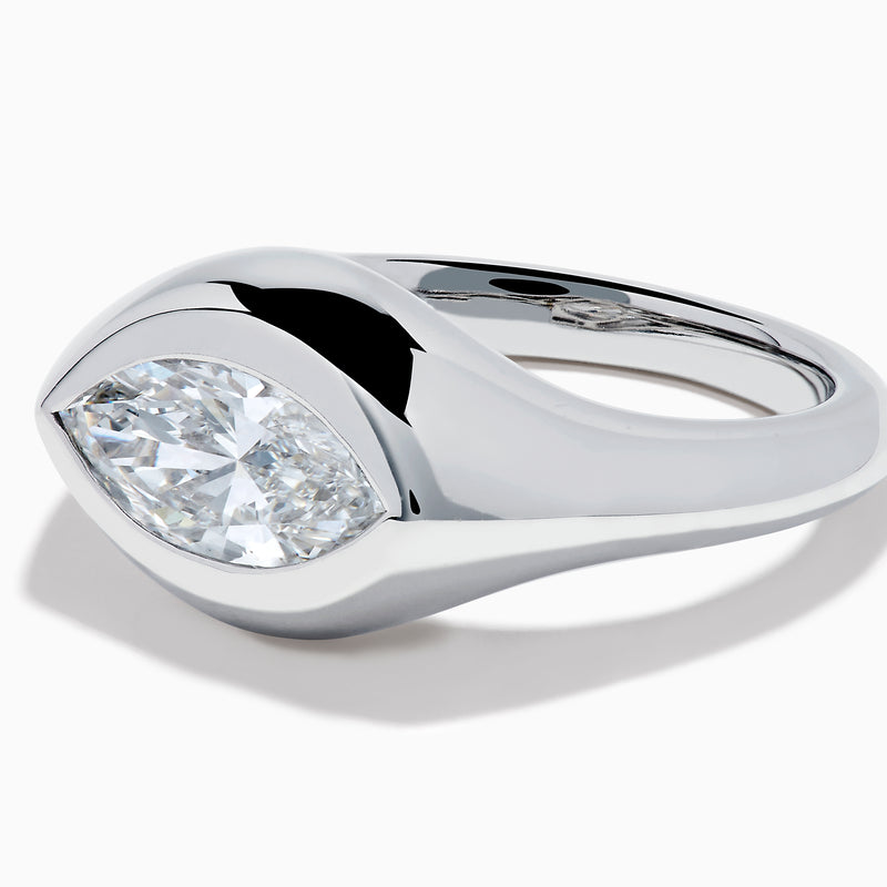The Lab Grown Diamond Marquise Bezel Pinky Ring in 14K White Gold showcases a large marquise-shaped lab grown diamond set on a smooth, curved band, photographed against a white background.